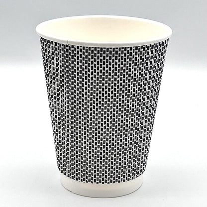 Black and white patterned paper cup on a light gray background